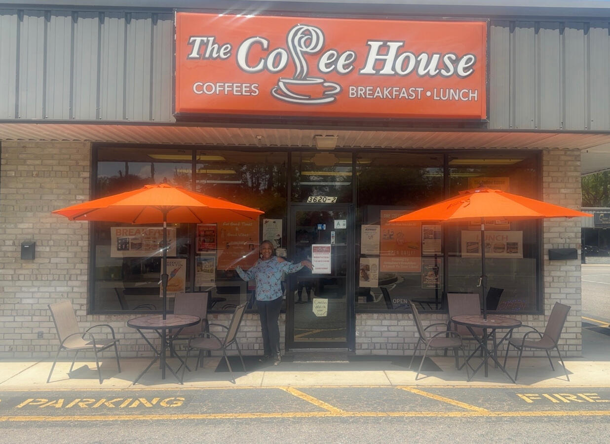 Ms. Quincy welcoming you to The Coffee House ch-founder